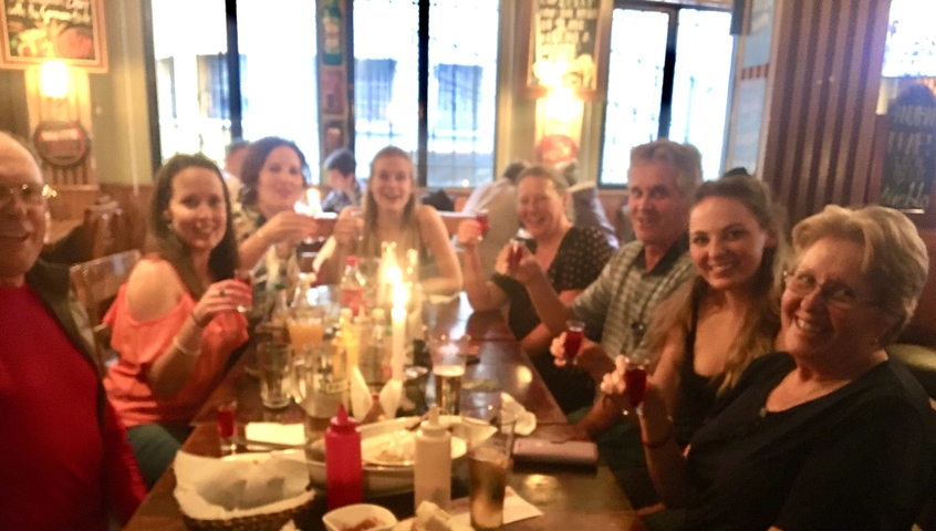       People dining together at a restaurant.
  