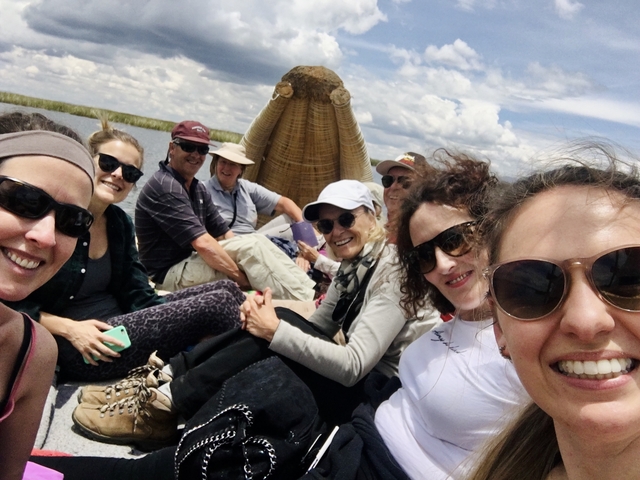       Group of people on a boat on a sunny day.
  