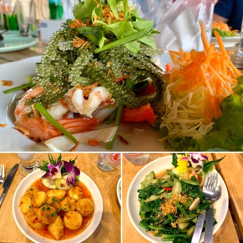 A close-up of a seafood dish with various garnishes.