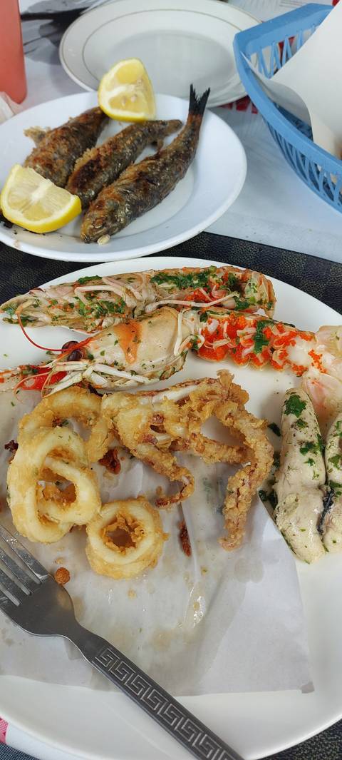       Assorted seafood dish with fried calamari and fish.
  
