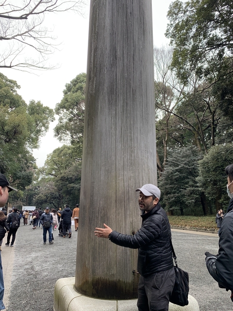 A large gate with people looking on.