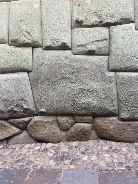      Close-up of seamlessly fitted ancient stone wall blocks.
  