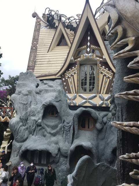 Unique architectural building with tourists.