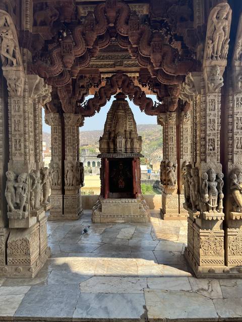 Intricately carved stone temple with views to countryside.