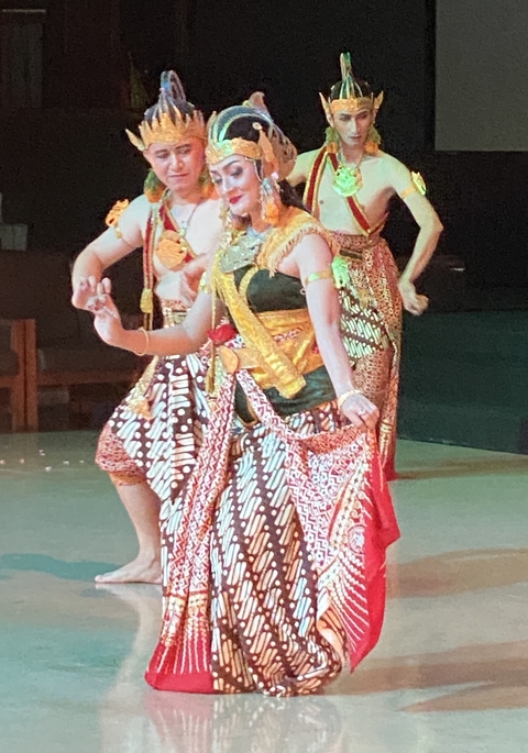       Traditional dancers in colorful costumes.
  