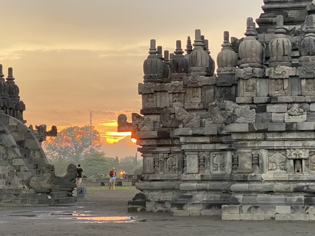       Sunset view of an ancient temple with intricate carvings.
  