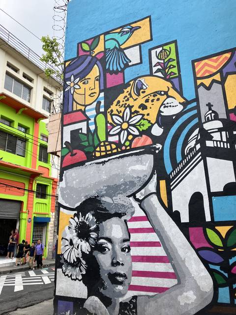 Colorful street mural with vibrant designs.