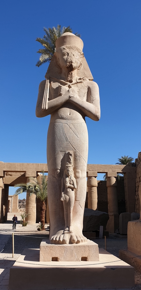 Large statue of an ancient Egyptian pharaoh.