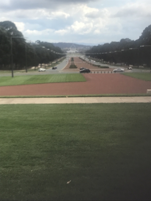 Blurry image of a roadway with vehicles.