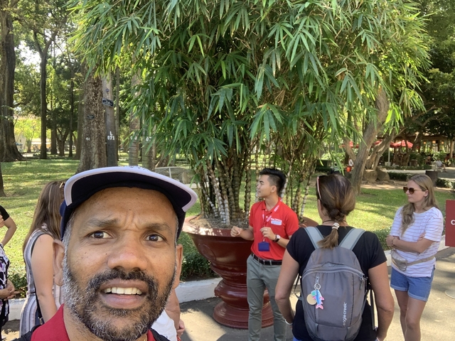Tour group with a guide in a park area.