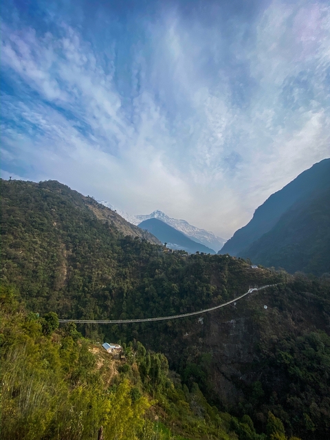       Landscaped view of mountains with sky in the background.
  