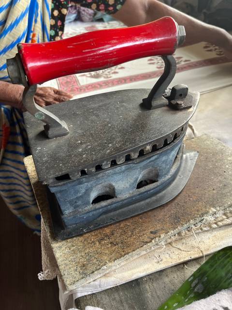 Close-up of an iron lying on its side.