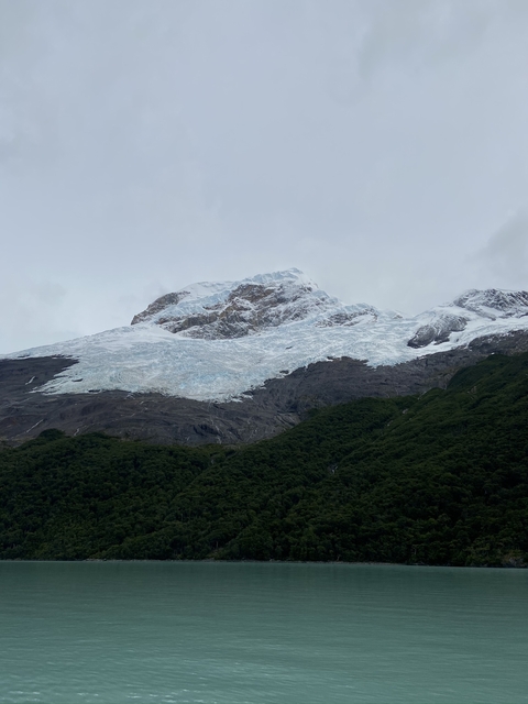Snow-capped mountain with glacier.