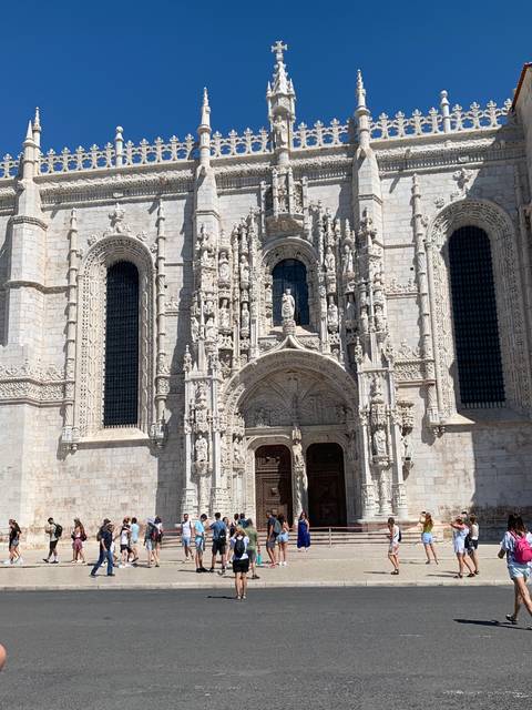       Ornate historical building with intricate stone carvings.
  