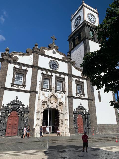       Historical church building with a clock tower.
  