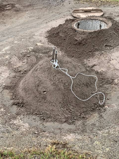 Ground with metal rods and cables.