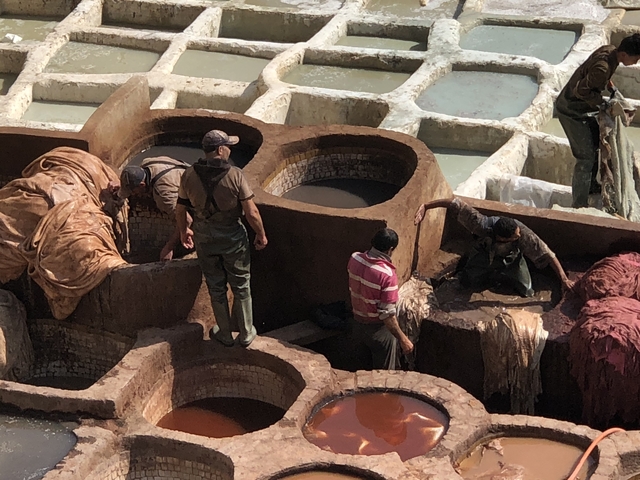 Workers operating in a traditional tannery.