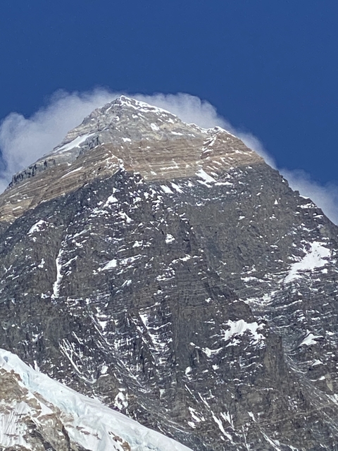 Close-up of a snow-capped mountain peak.