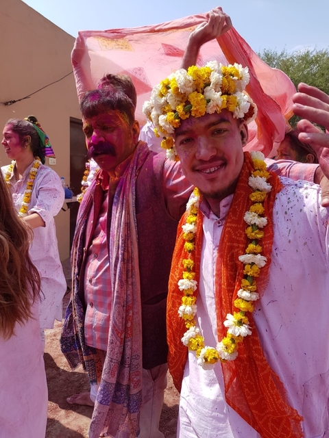 People enjoying Holi festival with vibrant colors.