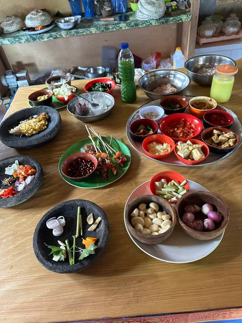       Ingredients and food preparations on a table.
  