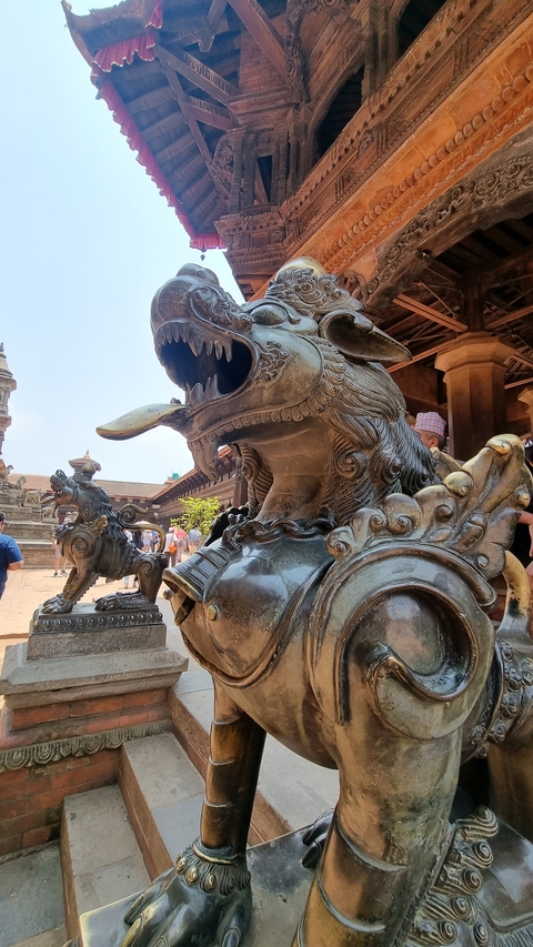       Close-up of ornate metallic sculptures at a historic site.
  