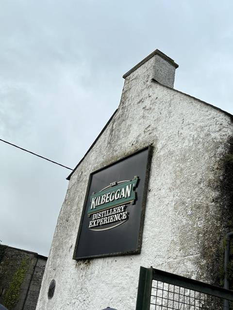 A building with 'KILBEGGAN Distillery Experience' sign.