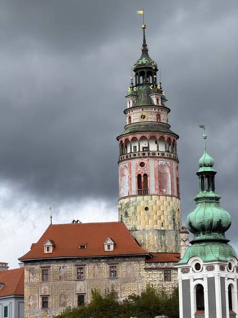 Tall clock tower against a cloudy sky