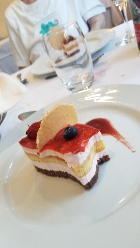 Dessert with berry topping on a plate.