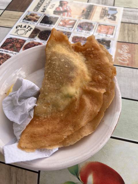 A dish of fried food on a white paper towel.
