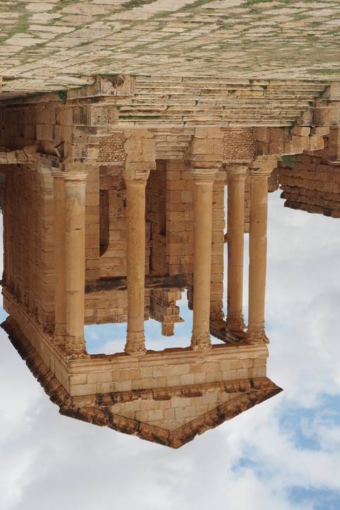       Ruins of a Roman temple with detailed columns.
  