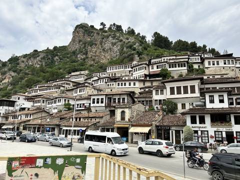       Street with traditional Balkan houses lined on either side.
  