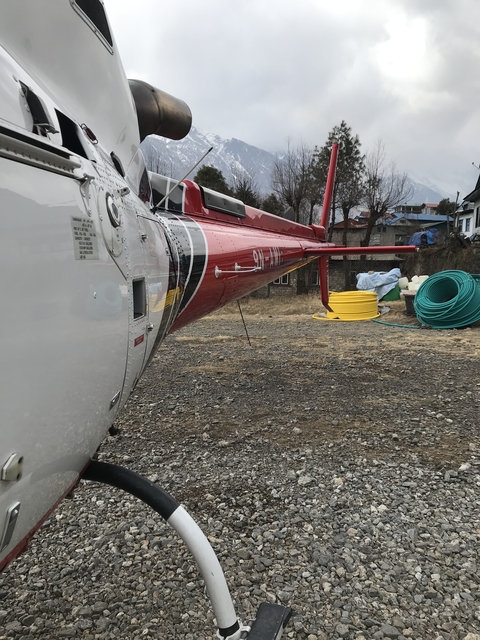       Close-up of a parked helicopter.
  