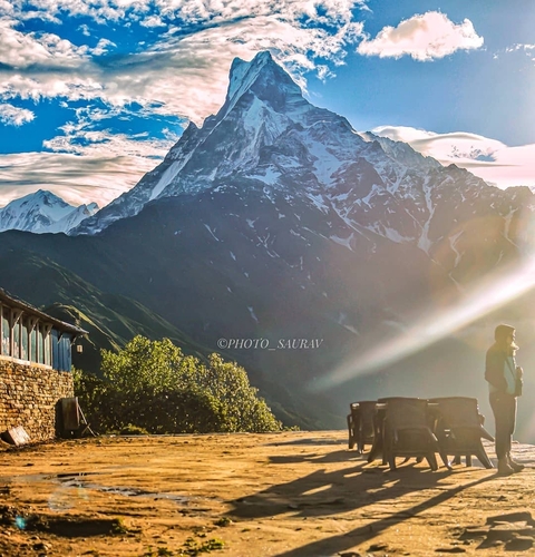       View of snowy mountain range with watermark in lower corner.
  