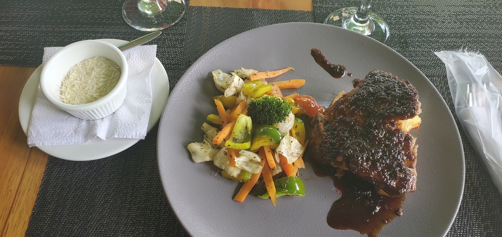 A plated meal with vegetables and sauce.