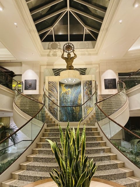       Interior of a building with a decorative staircase.
  