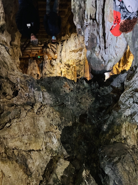      Inside of a cave with stalagmites and stalactites.
  