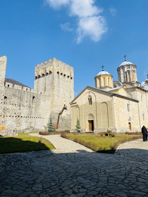      Historical church and fortress with towers.
  