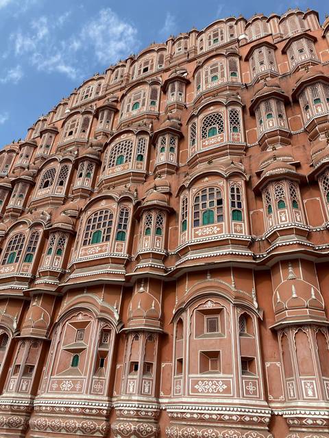 Detailed architecture of the Hawa Mahal against a blue sky.