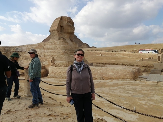 Person standing in front of the Sphinx.