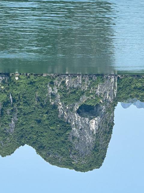       Limestone karst formation by the water.
  