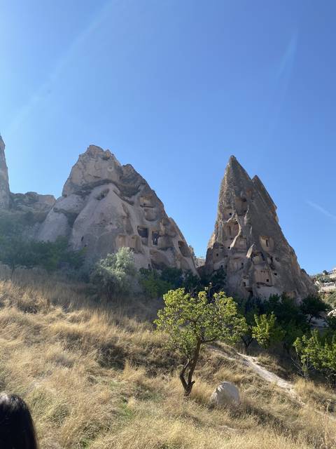 Rock formations with cave dwellings in Cappadocia.
