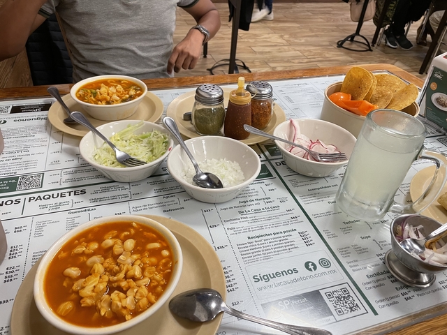       Table with various Mexican foods and drinks
  