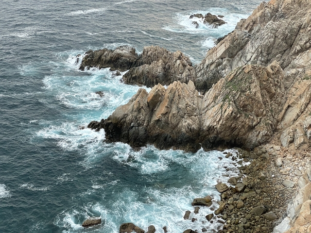       Rugged coastline with crashing waves
  