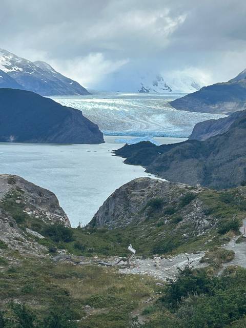       A stunning landscape of mountains and a fjord.
  