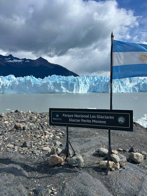 View of a glacier and a sign.