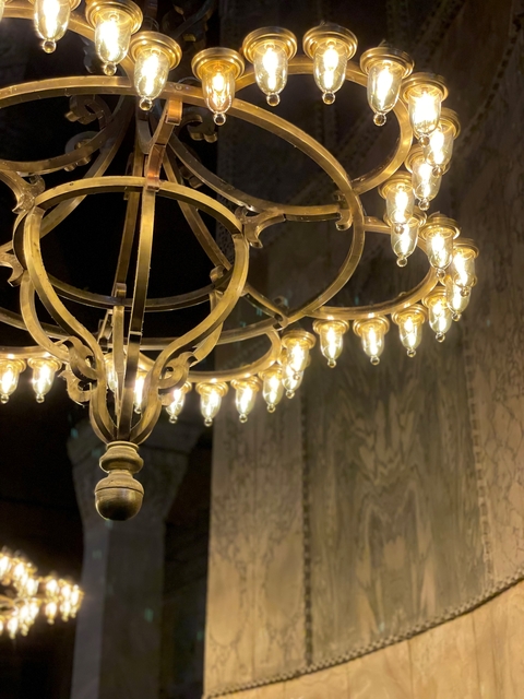 Close-up of a chandelier with ornate design.