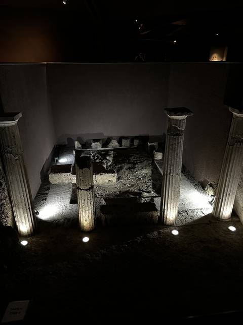       Ancient archaeological ruins displayed in a museum.
  