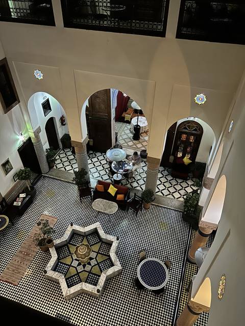       A traditional interior courtyard with intricate tilework.
  