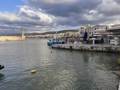 Harbor view with yachts and restaurants.