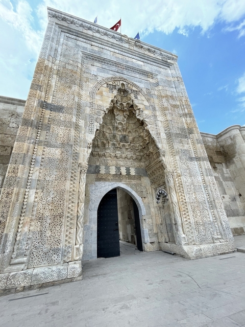       Ornately decorated entrance of a historical building.
  